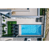 Rektangulär blå Glasfiberpool Aruba 700 med klart vatten och kakelkanter, 7,20m x 3,70m x 1,50m