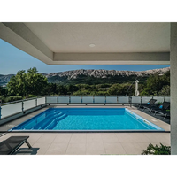 Glasfiberpool Aruba Plus 8x3,7x1,5m med klarblått vatten och grå kant