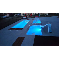 Blå upplyst Bahama trädgårdspool med rutschkanor och vattenfall, 11,10m x 3,75m x 1,50m