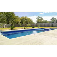 Leisurepools Limitless rektangulär pool för begränsat utrymme med blåvatten och betongdäck