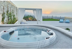 PassionSpa Recharge-spabad – Pure Collection, hvid overflade, rund form, massagedyser, røde detaljer